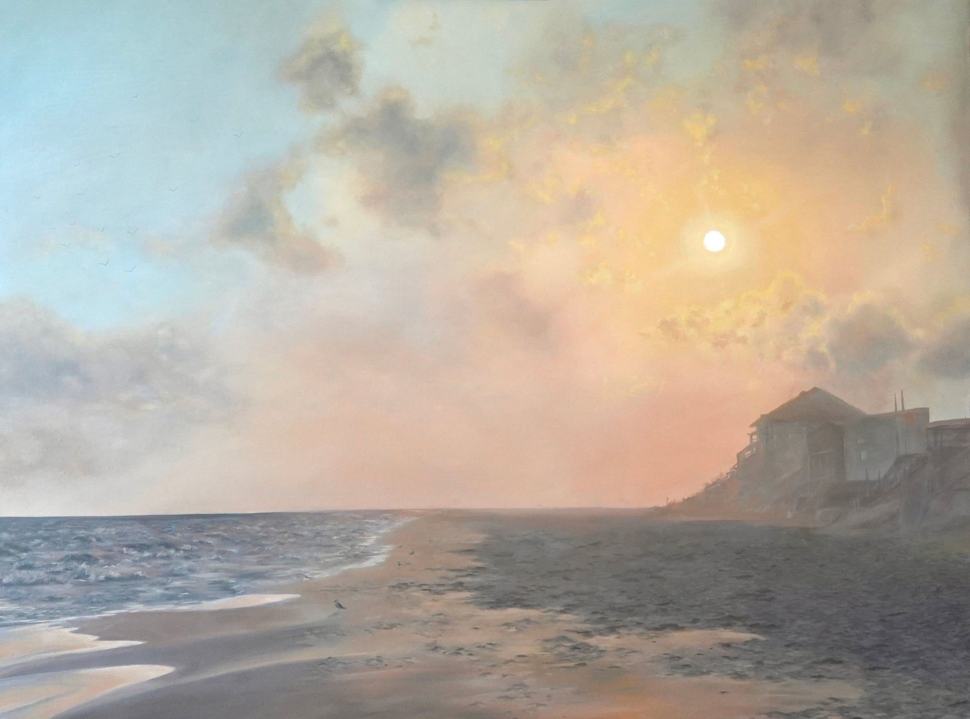 Sunset over a beach with a lighthouse and smoke in the sky