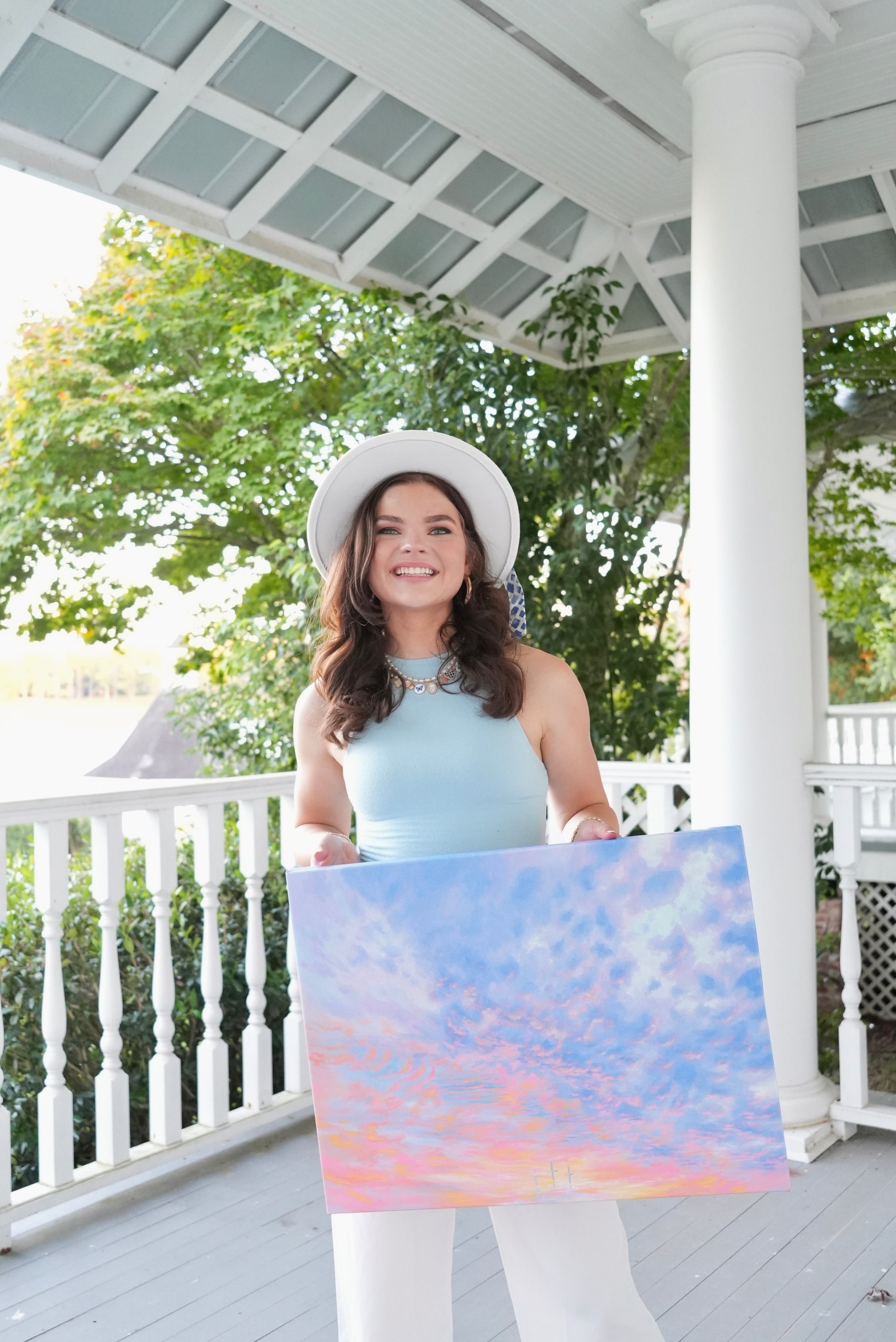 Avery holding a canvas print