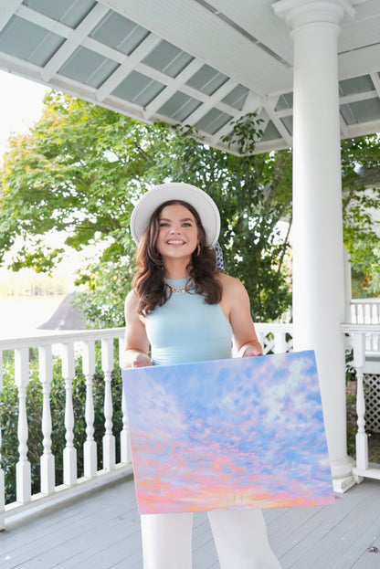 Avery holding a canvas print