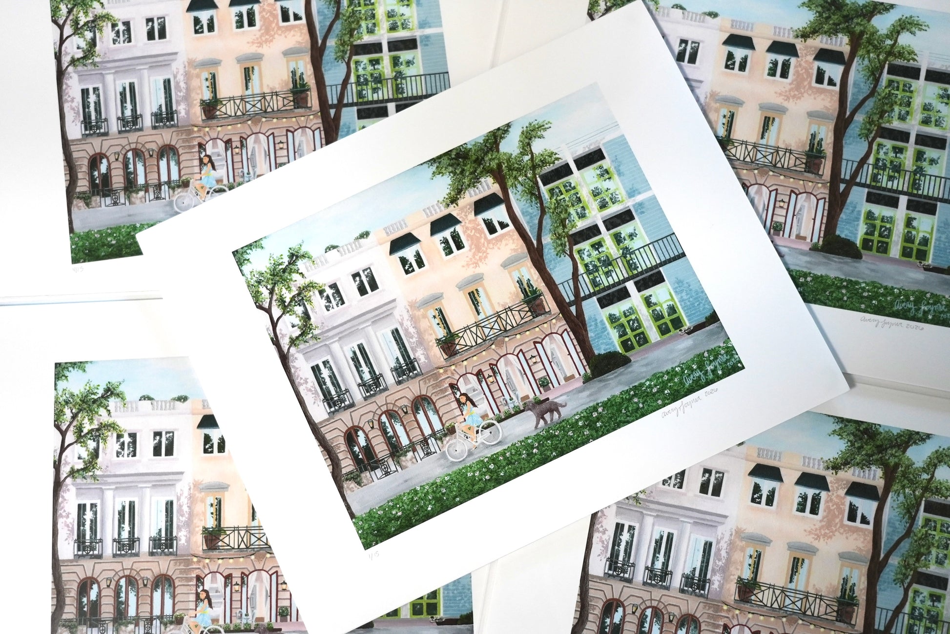 Collection of prints with illustrations of buildings and trees.