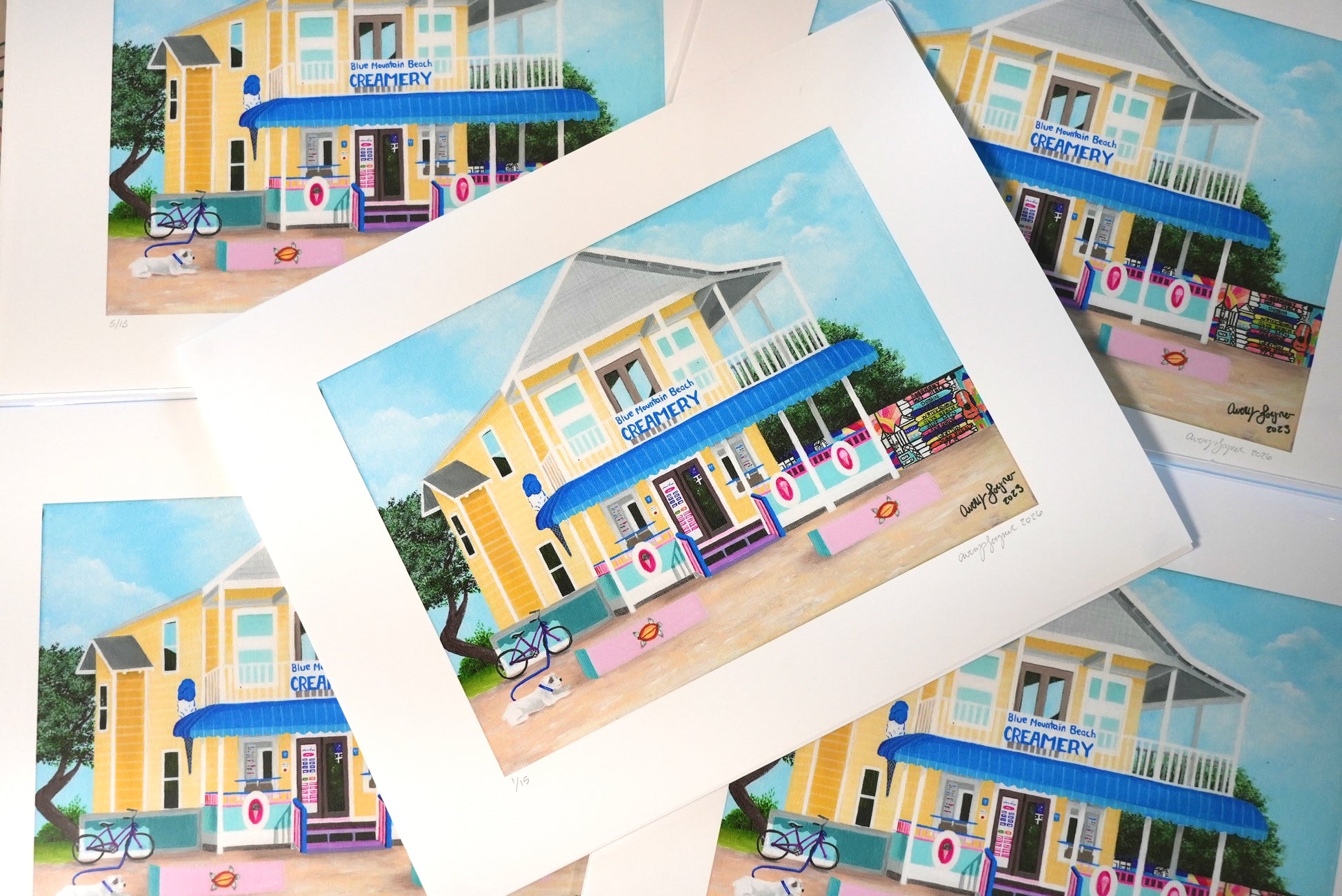 Collection of prints featuring a colorful building with a blue awning.