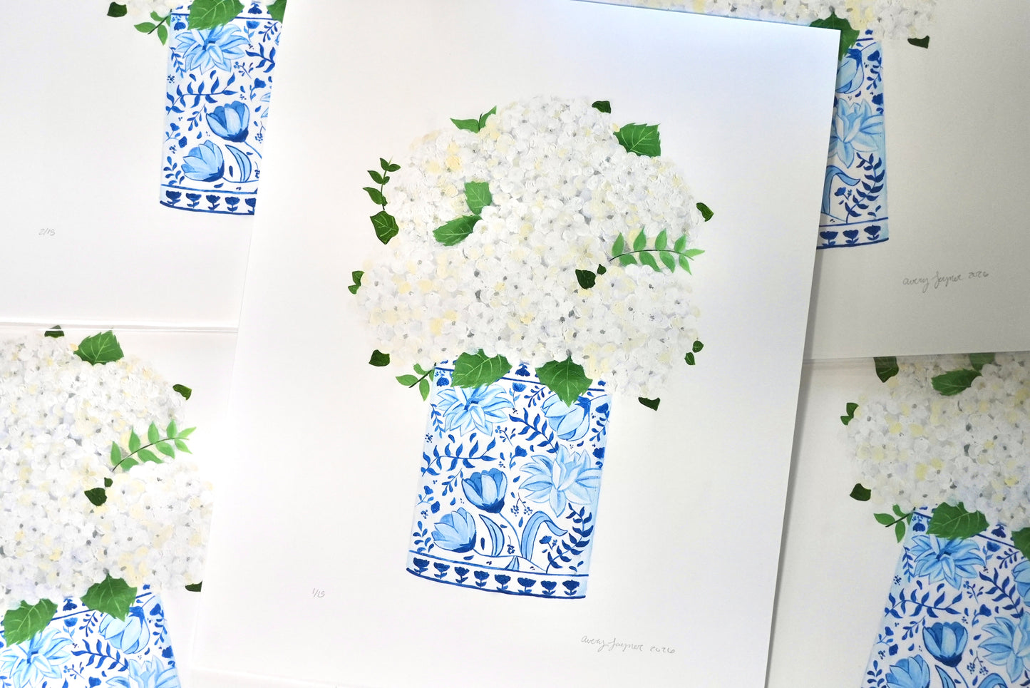 Art print of white flowers in a blue and white vase on a white background