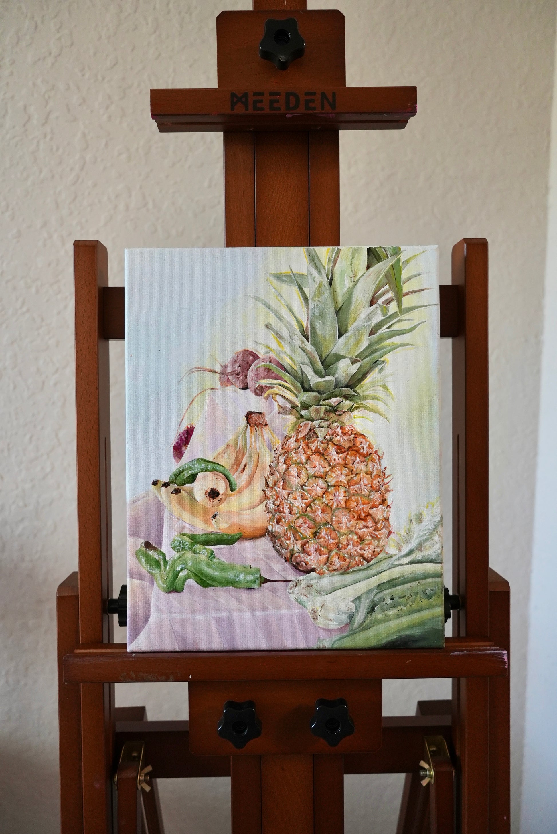 Still Life Painting of fruits and vegetables on an easel