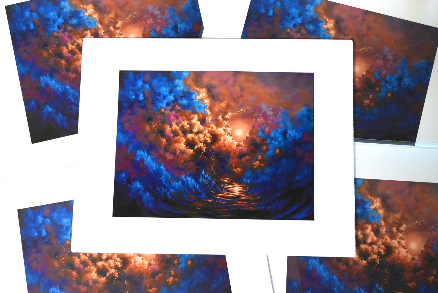 Collage of cloud-themed greeting cards with a central focus on a framed artwork.