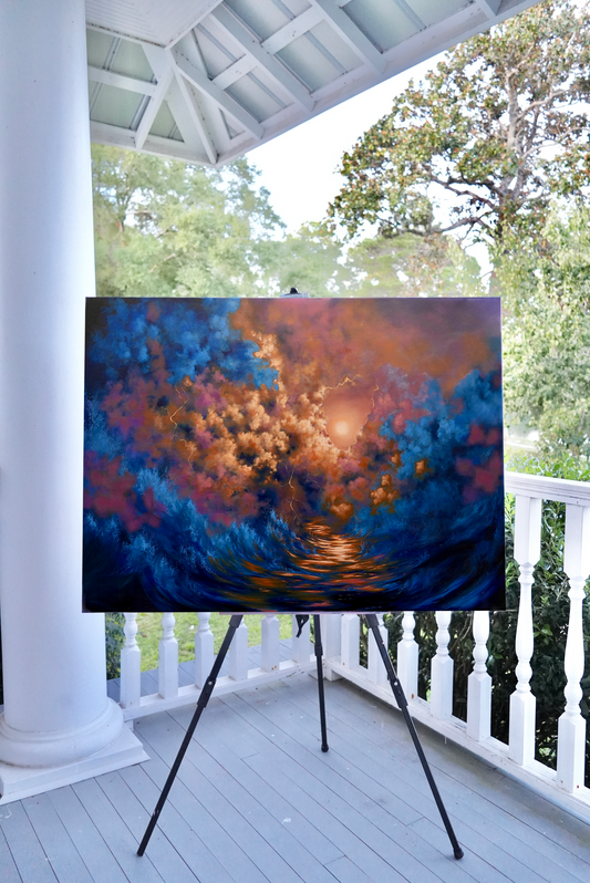 Colorful abstract painting on an easel outdoors on a porch