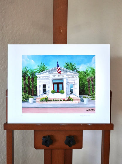 Painting of a building with an American flag on an easel against a beige wall