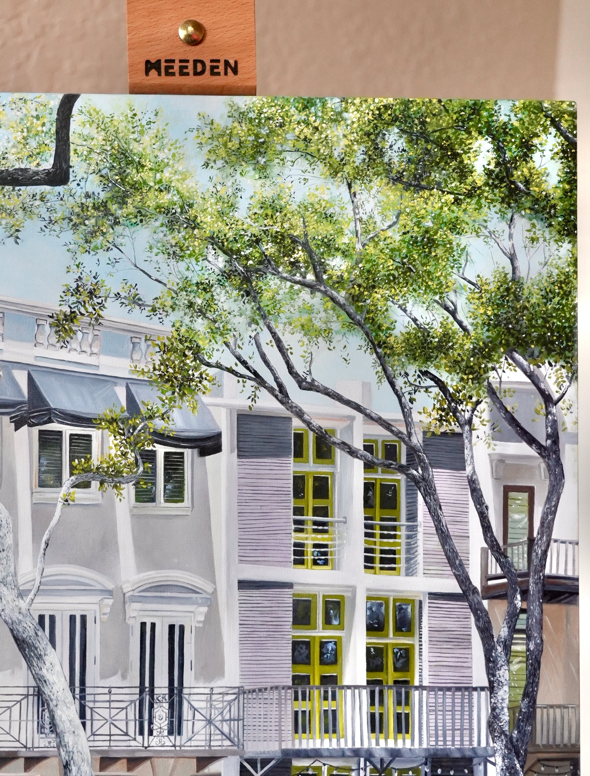 Artistic depiction of a building with greenery and 'MEEDEN' branding.