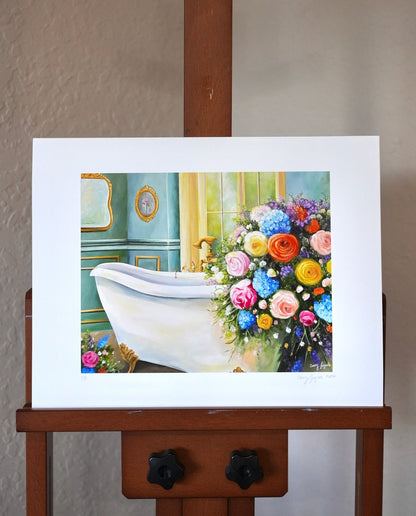 Art print of a bathroom scene with flowers on an easel against a plain wall.