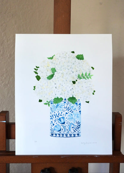 Art print of a blue and white floral pot on a white background